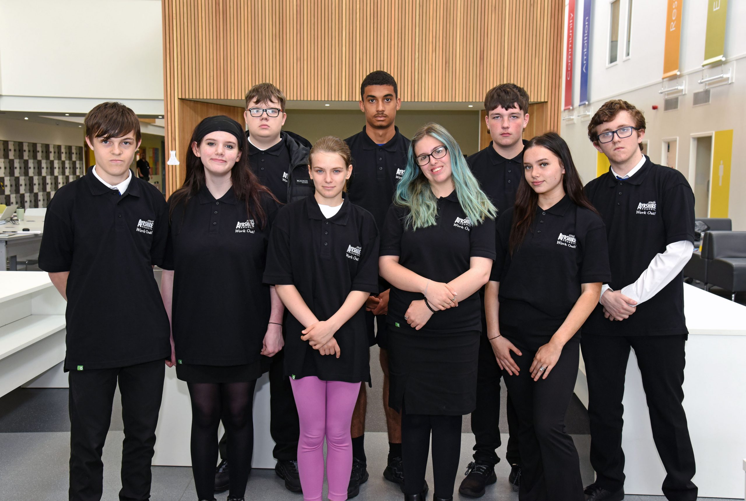 A group of young boys and one girl with South Ayrshire Council black tops